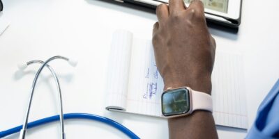 a hand holding a smart watch